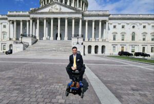 Chris Carrino posing outside of Capitol Hill building.